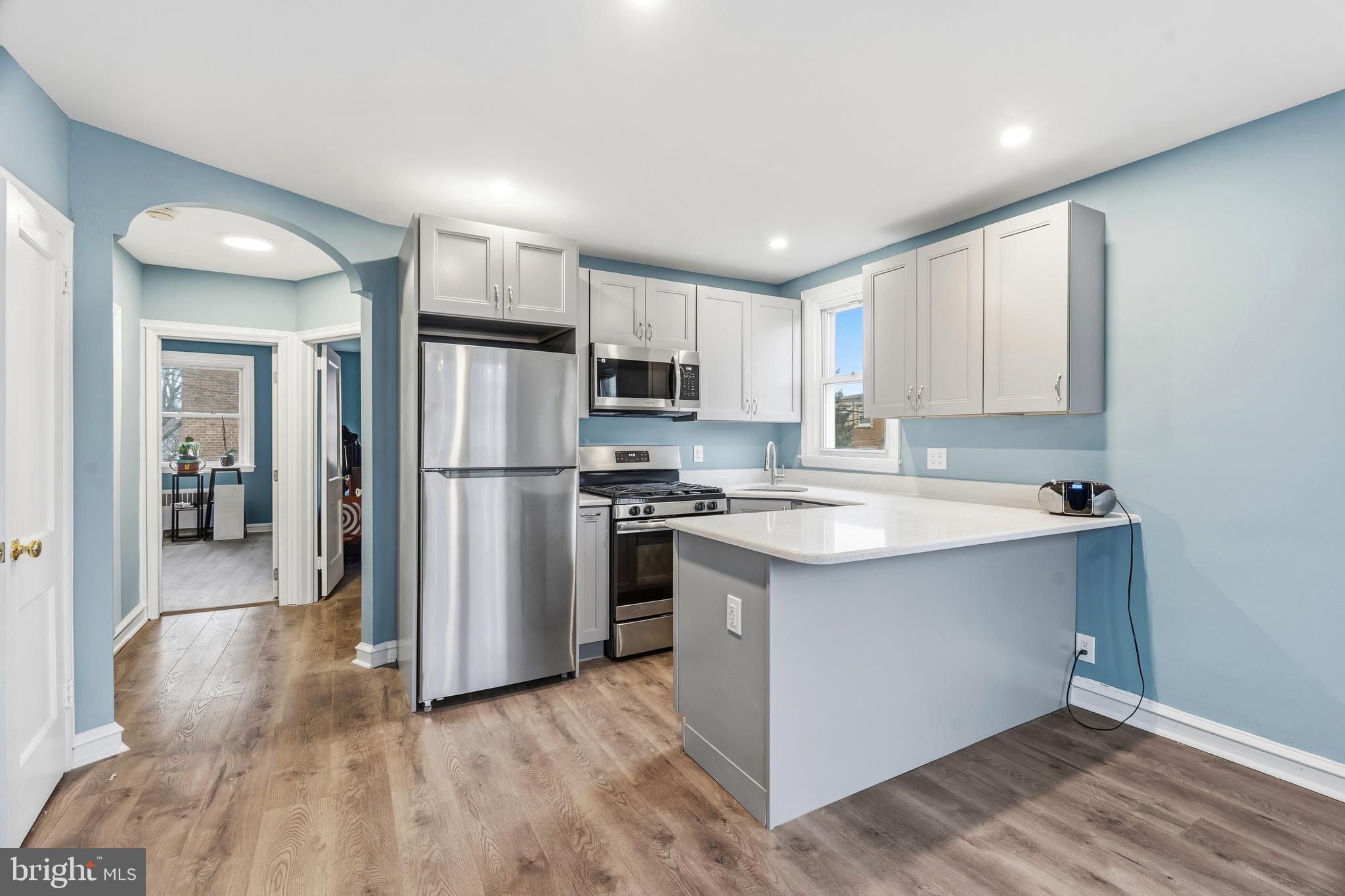7318 Frontenac Street Philadelphia, PA 19111 - Photo 5 of 13 a kitchen with stainless steel appliances granite countertop a refrigerator and a stove top oven