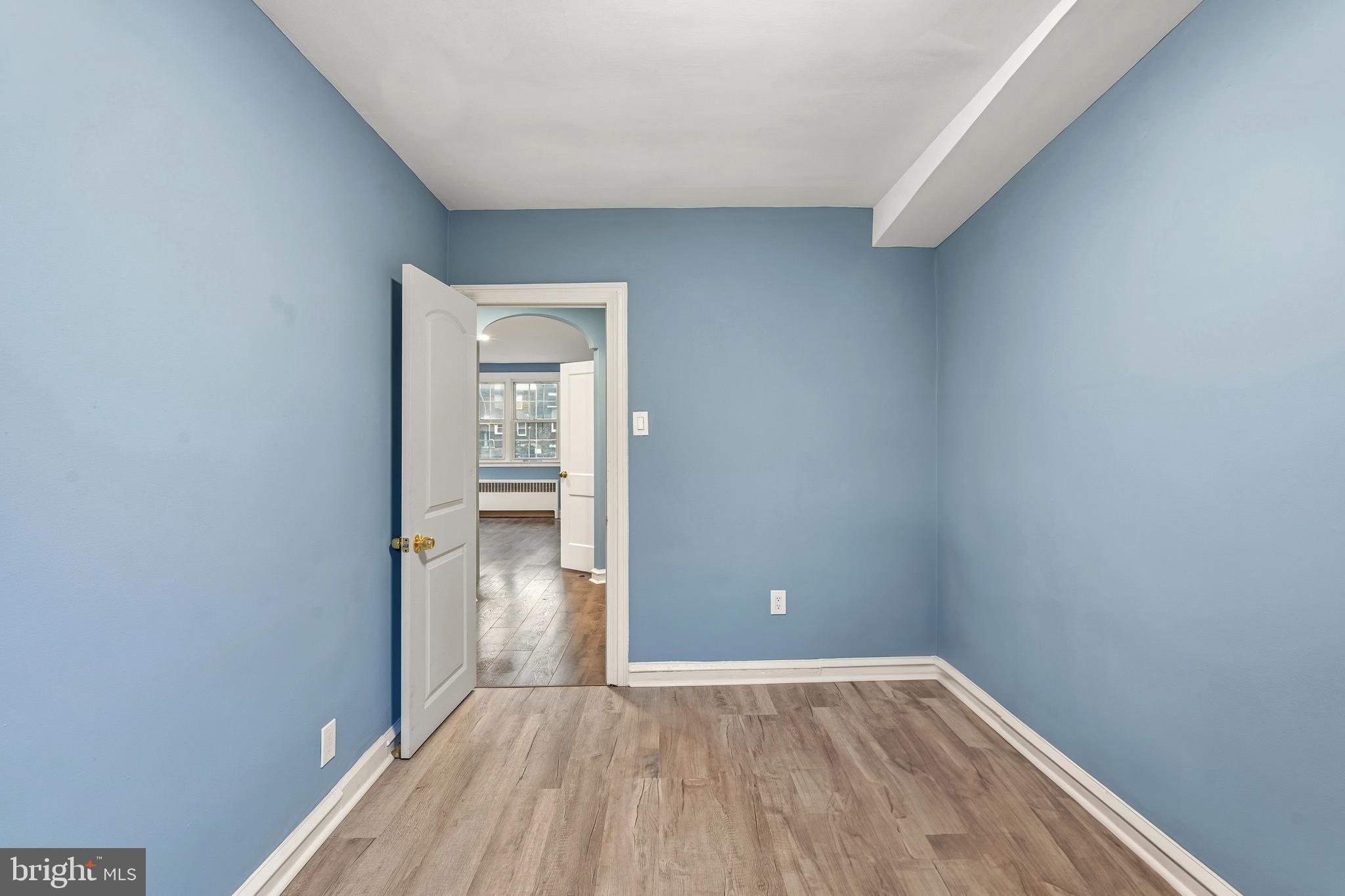 7318 Frontenac Street Philadelphia, PA 19111 - Photo 9 of 13 a view of an empty room with closet and wooden floor