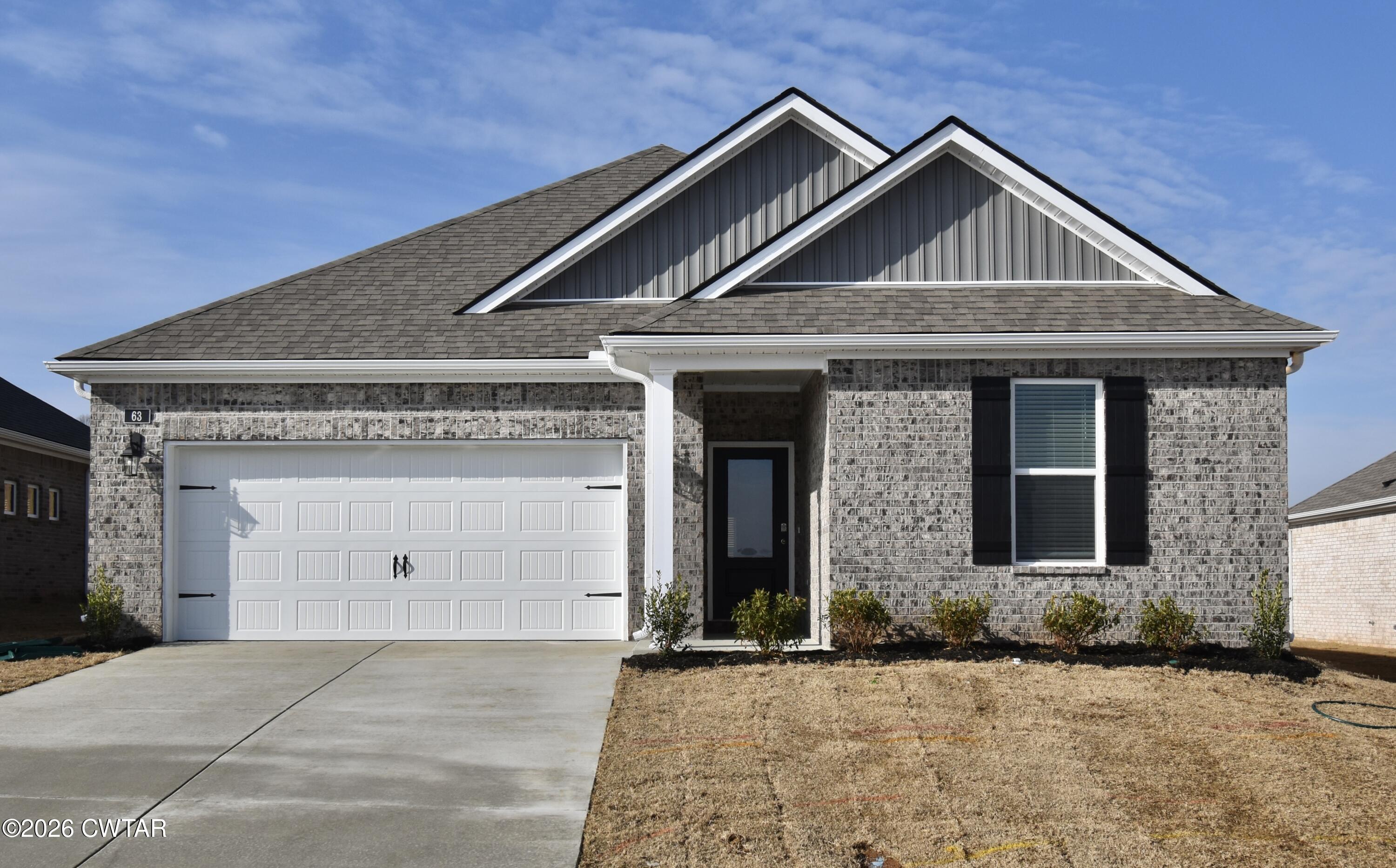 a front view of a house with yard