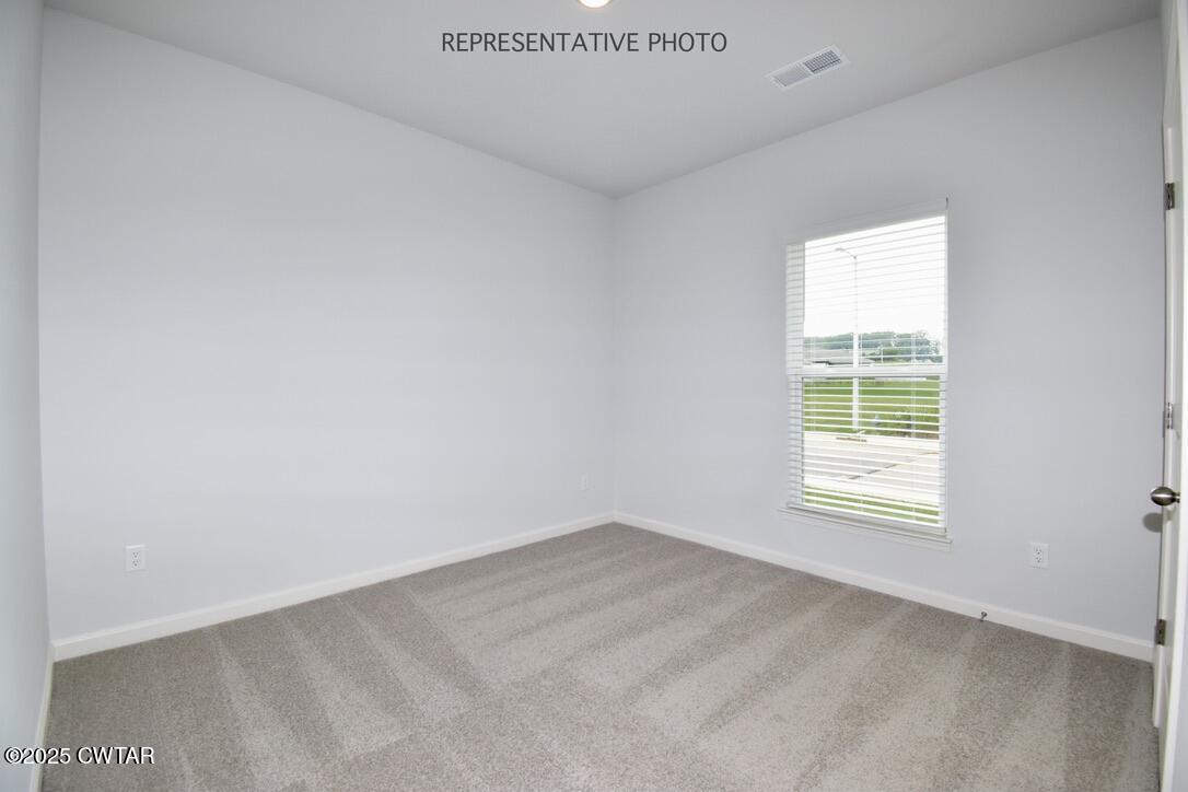 63 Clarendon Cove Jackson, TN 38305 - Photo 14 of 18 a view of an empty room with a window
