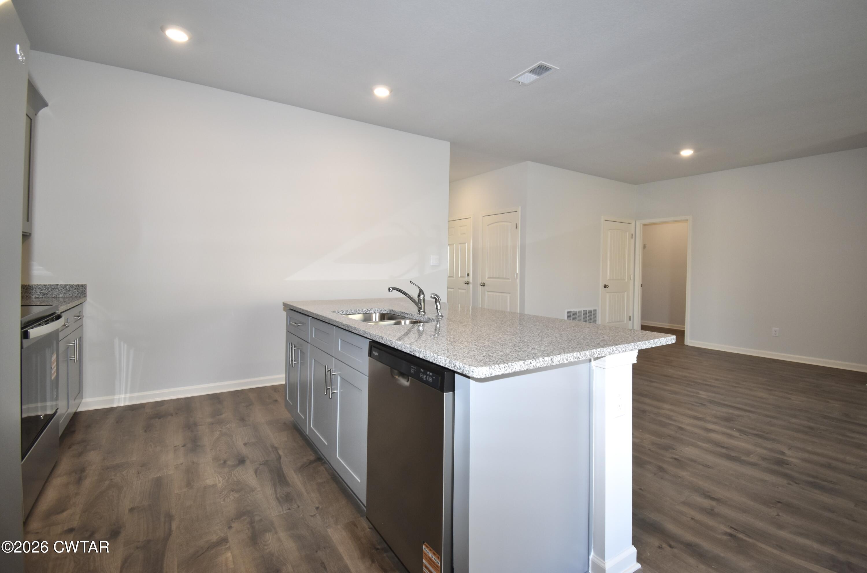 63 Clarendon Cove Jackson, TN 38305 - Photo 8 of 18 a kitchen with a sink and wooden floor