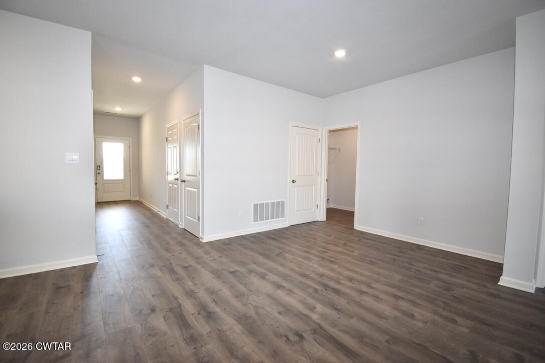 63 Clarendon Cove Jackson, TN 38305 - Photo 10 of 18 a view of a hallway with wooden floor