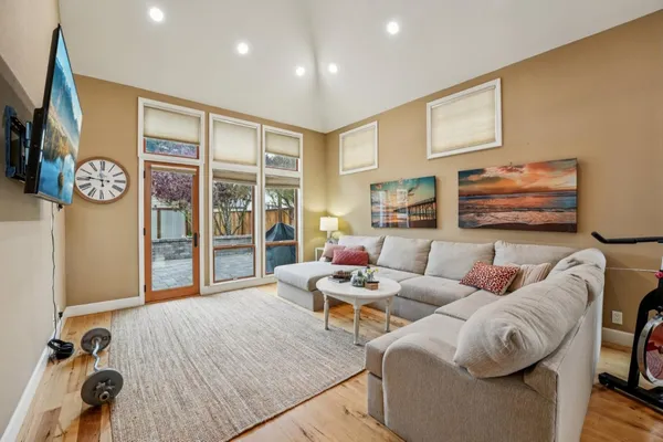 a living room with furniture and a flat screen tv