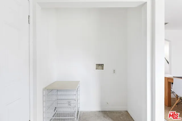 a house view with a seating space and garden