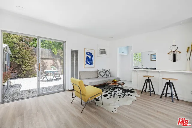 a kitchen with stainless steel appliances a stove a sink and a refrigerator