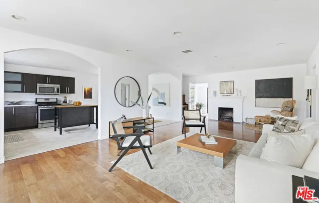 a living room with fireplace furniture and a flat screen tv