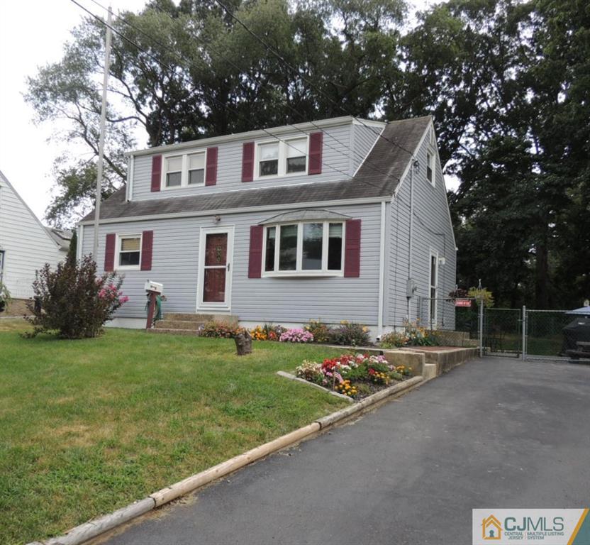 7 Channing Road East Brunswick, NJ 08816 - Photo 1 of 11 a front view of a house with a garden