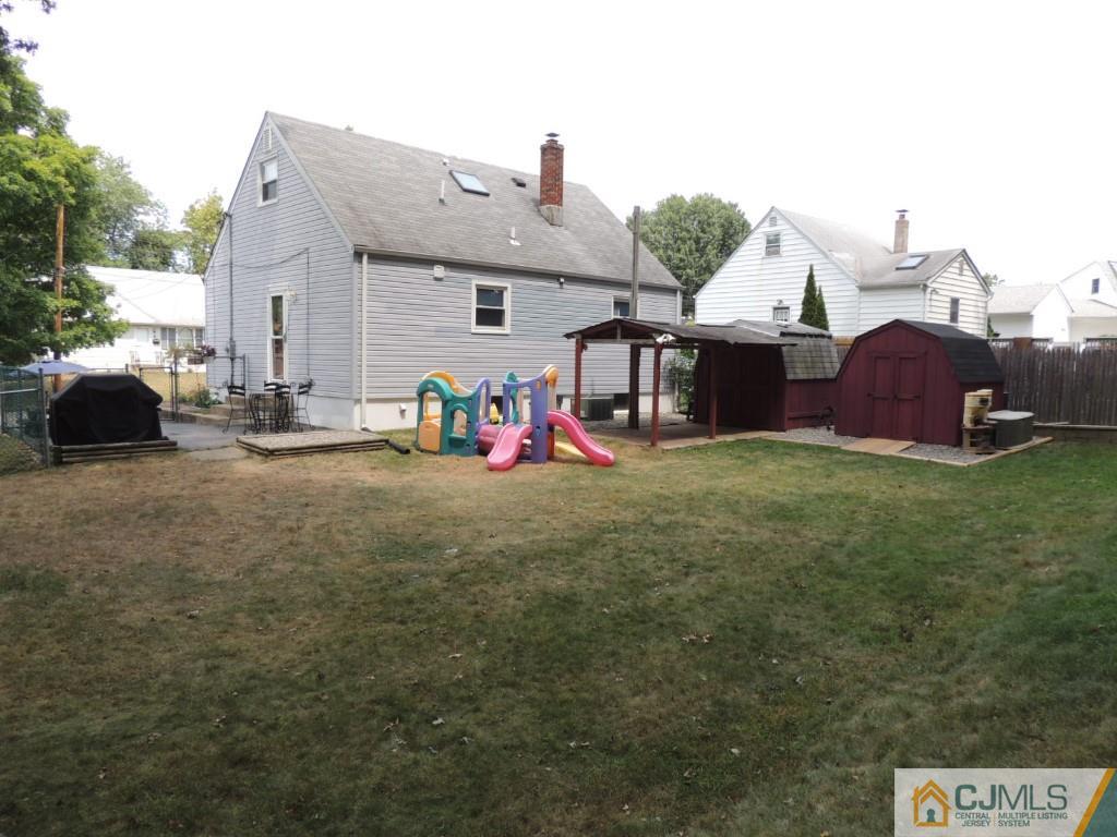 7 Channing Road East Brunswick, NJ 08816 - Photo 11 of 11 a view of front of house with outdoor seating