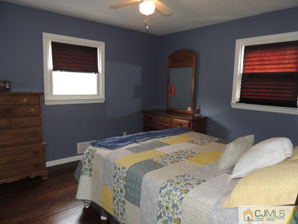 7 Channing Road East Brunswick, NJ 08816 - Photo 5 of 11 a bedroom with a bed and a window