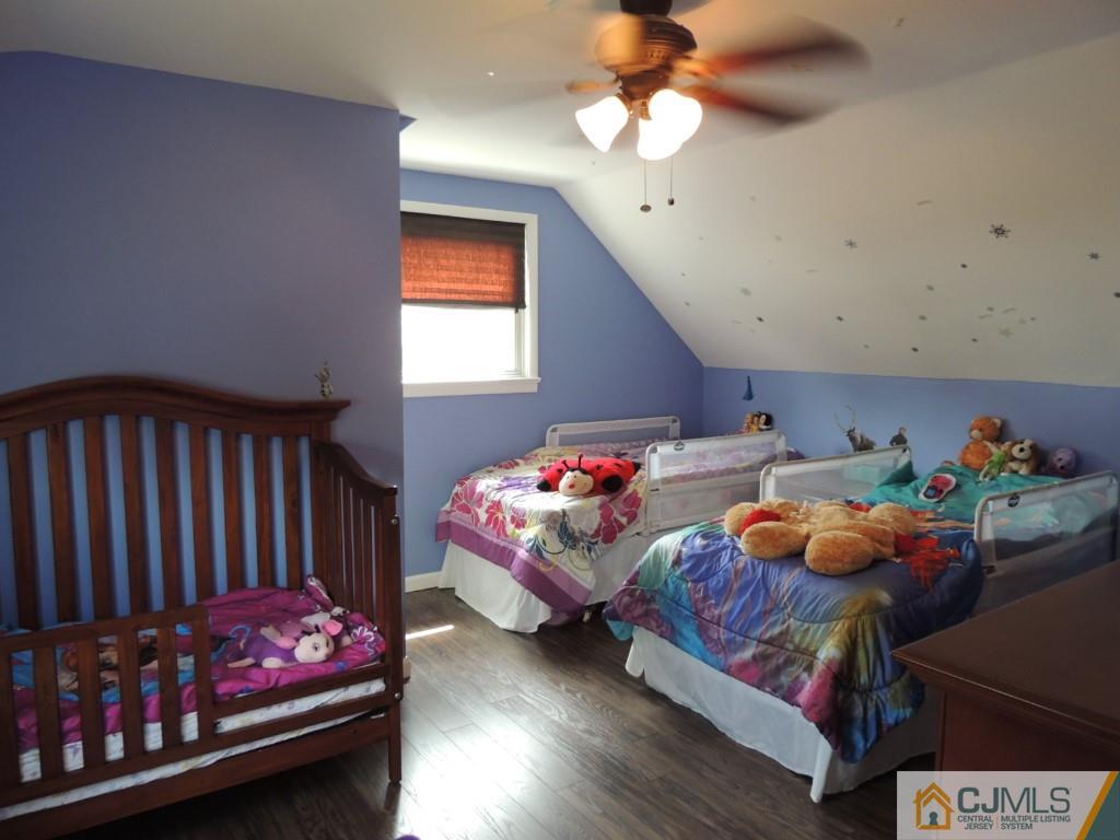 7 Channing Road East Brunswick, NJ 08816 - Photo 10 of 11 a bedroom with furniture and a baby crib