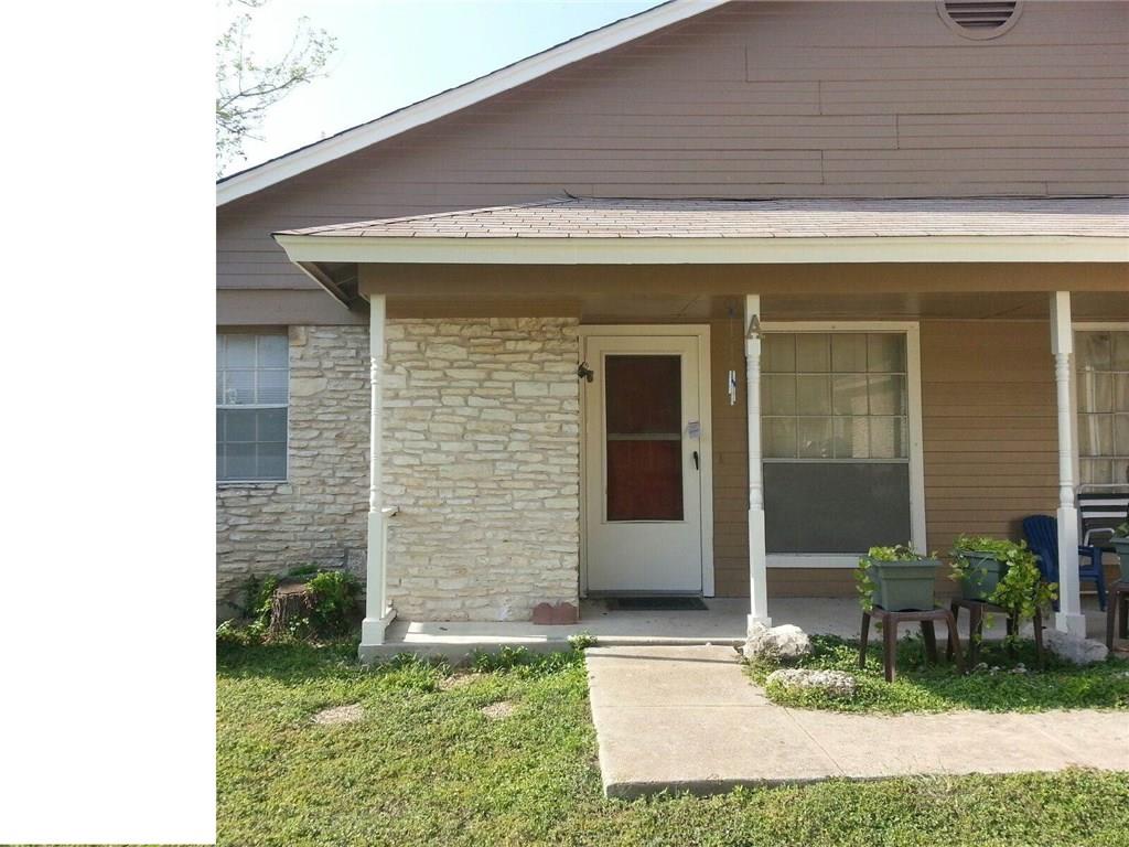 9706 Eastwend Drive, Unit A Austin, TX 78753 - Photo 1 of 1 Property entrance with a porch, stone siding, and a yard