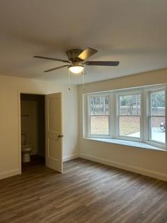 5190 Ozora Church Road Loganville, GA 30052 - Photo 19 of 34 a view of an empty room with wooden floor and a window