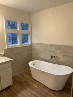 a white tub sitting next to a white roof