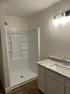 5190 Ozora Church Road Loganville, GA 30052 - Photo 24 of 34 a bathroom with a granite countertop sink a mirror and shower