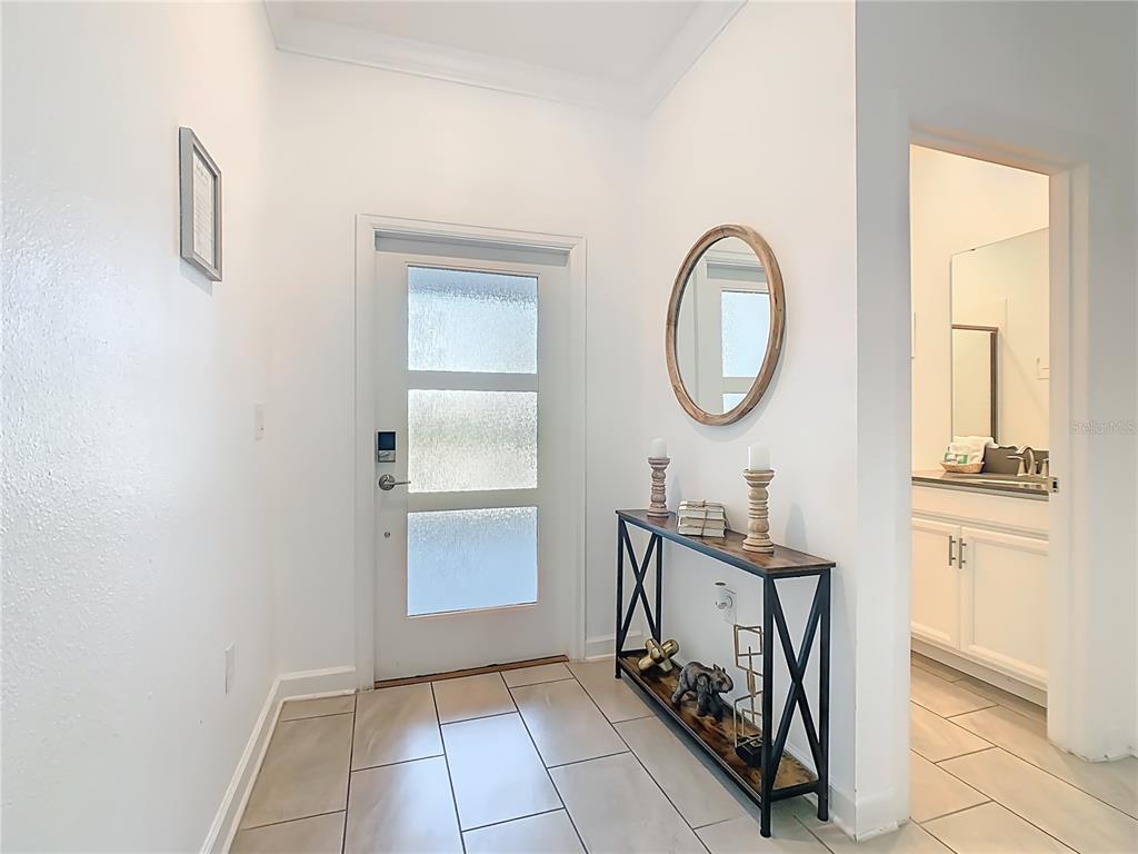 2957 Simile Street Kissimmee, FL 34746 - Photo 2 of 67 a very nice looking room with a mirror and a window