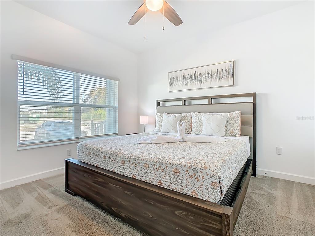 2957 Simile Street Kissimmee, FL 34746 - Photo 39 of 67 a bedroom with a bed and window