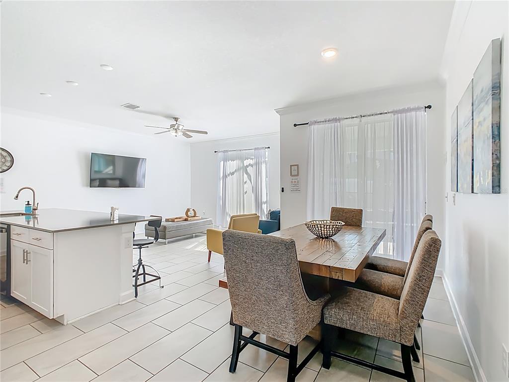 2957 Simile Street Kissimmee, FL 34746 - Photo 4 of 67 a view of a dining room with furniture