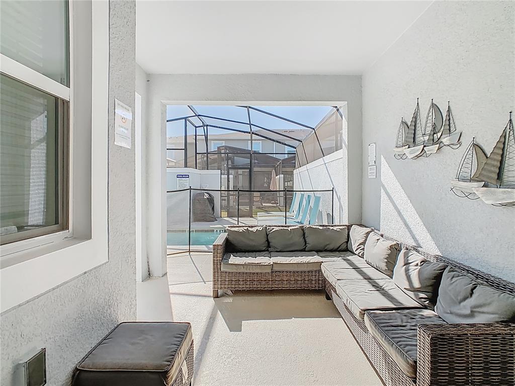 2957 Simile Street Kissimmee, FL 34746 - Photo 45 of 67 a living room with furniture and a couch