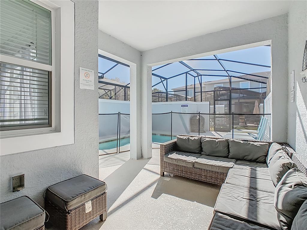 2957 Simile Street Kissimmee, FL 34746 - Photo 46 of 67 a living room with furniture and a window