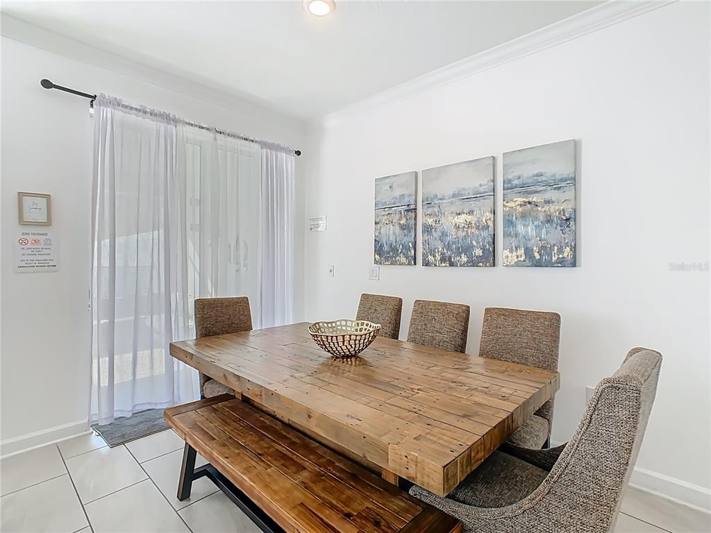 2957 Simile Street Kissimmee, FL 34746 - Photo 5 of 67 a bedroom with a bed and wooden floor