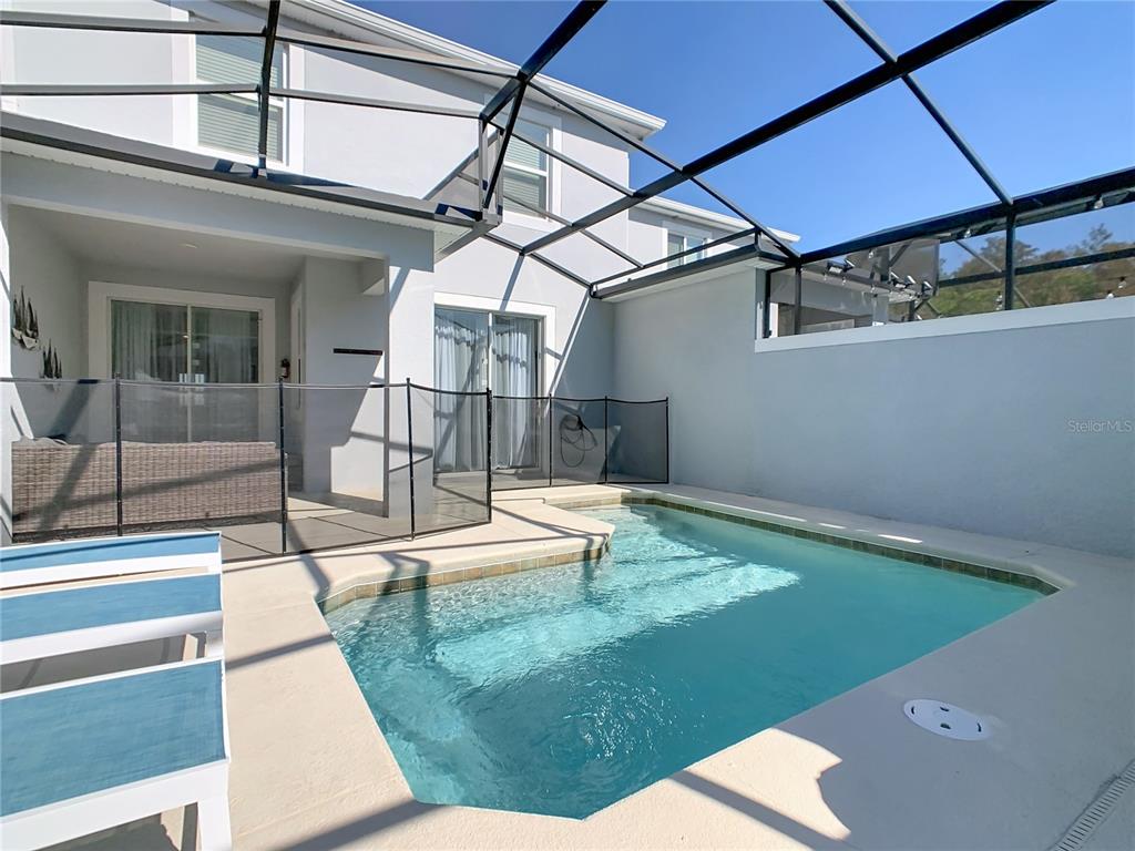 2957 Simile Street Kissimmee, FL 34746 - Photo 59 of 67 a view of a backyard with a patio