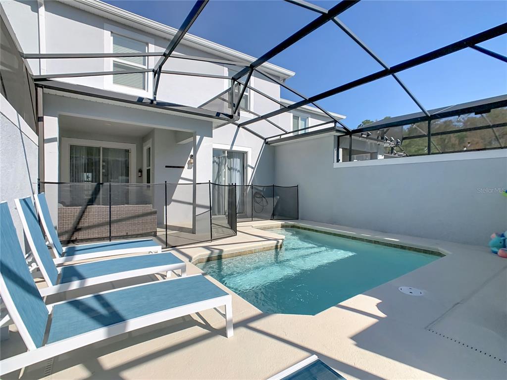 2957 Simile Street Kissimmee, FL 34746 - Photo 60 of 67 a view of swimming pool with seating area
