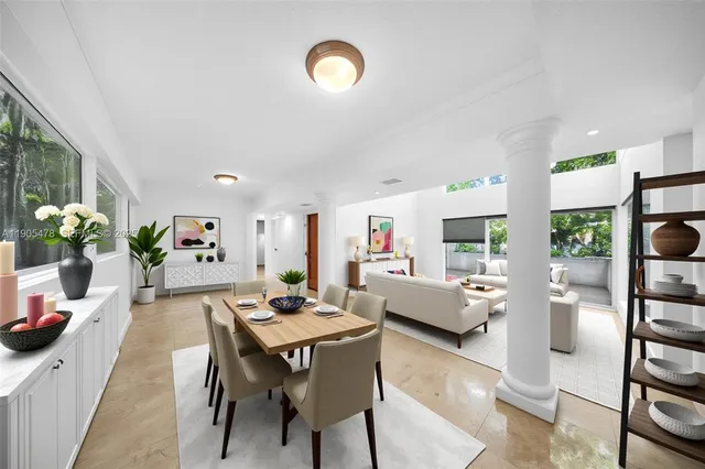 a kitchen with stainless steel appliances granite countertop a refrigerator a stove a sink and a refrigerator