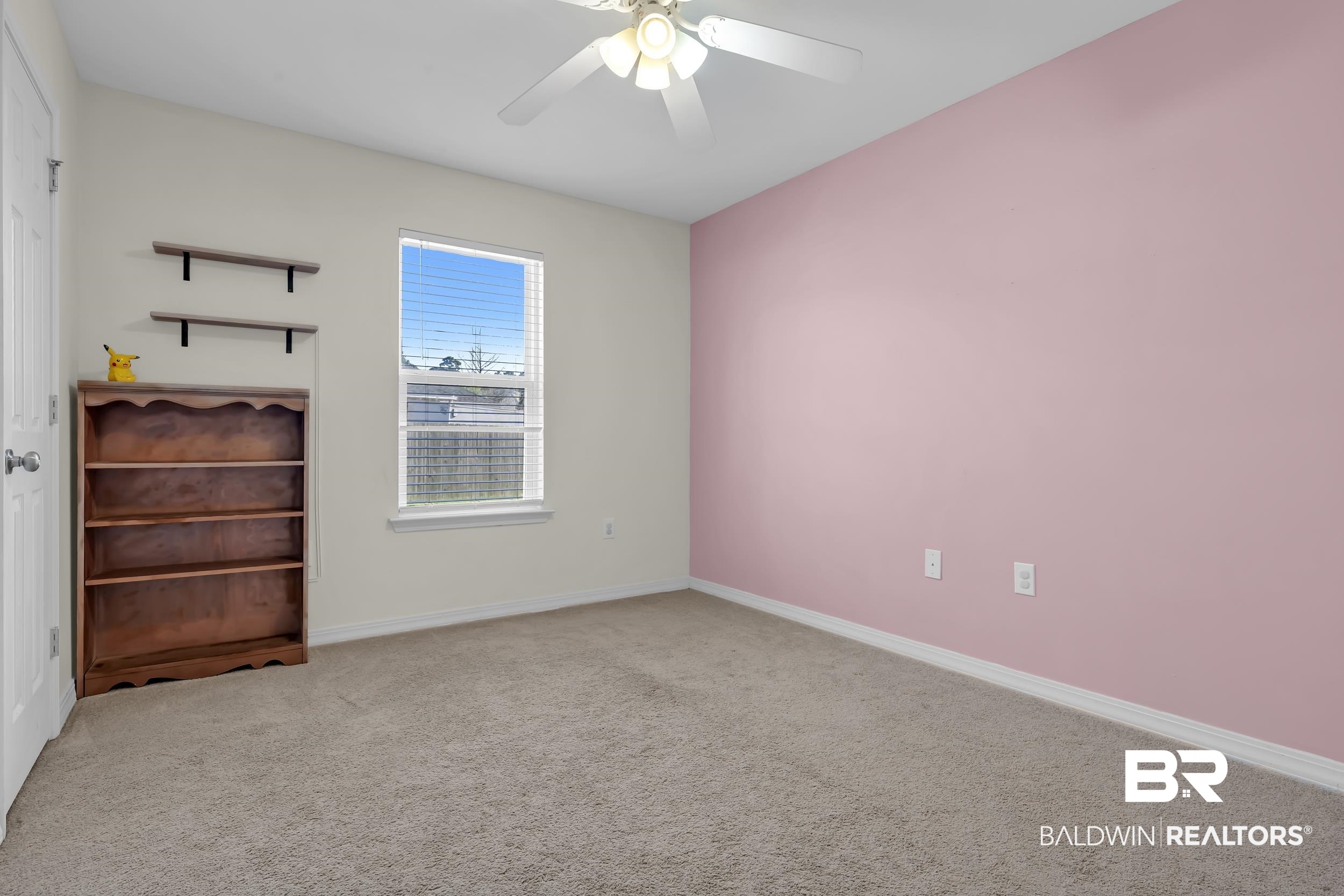 31527 Heidelbrook Loop Daphne, AL 36527 - Photo 17 of 22 Empty room featuring carpet and a ceiling fan