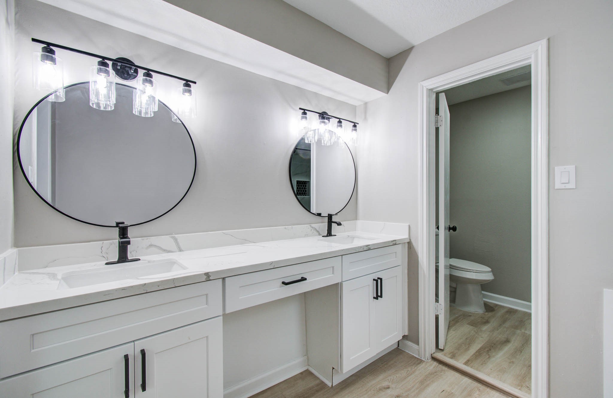 4735 Theall Road Houston, TX 77066 - Photo 29 of 36 a bathroom with a double vanity sink and a mirror