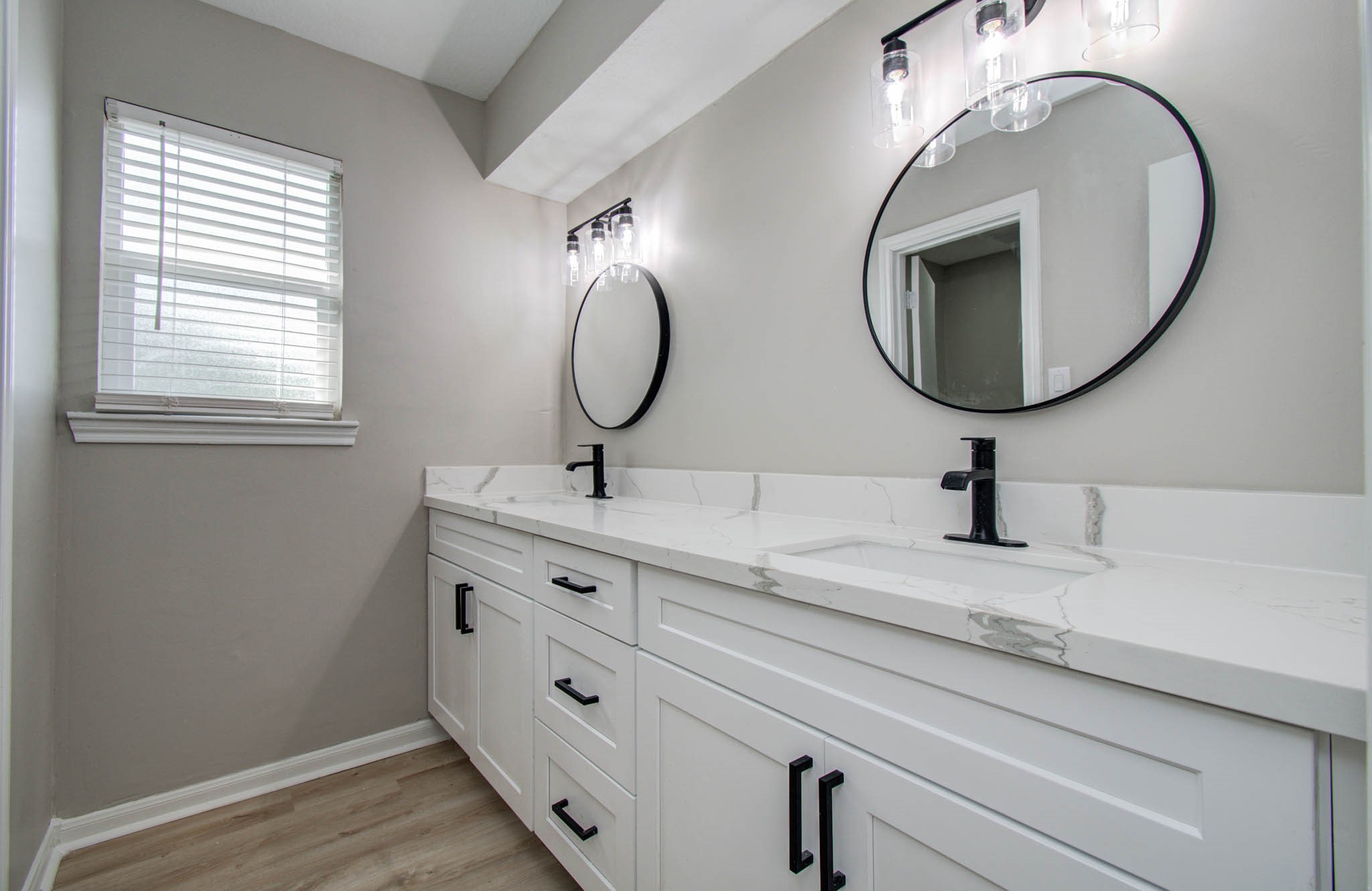 4735 Theall Road Houston, TX 77066 - Photo 32 of 36 a bathroom with a sink and a mirror