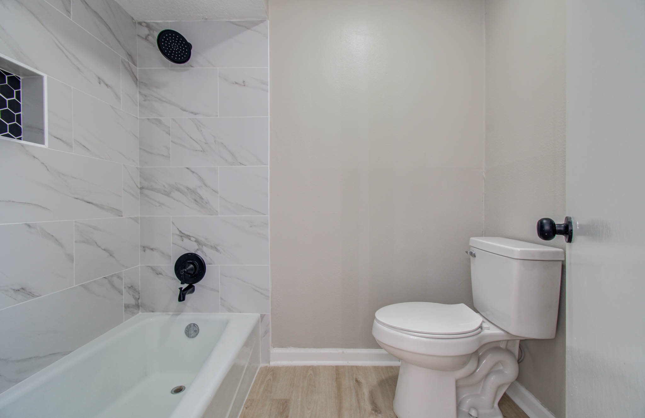 4735 Theall Road Houston, TX 77066 - Photo 33 of 36 a bathroom with a toilet and a shower