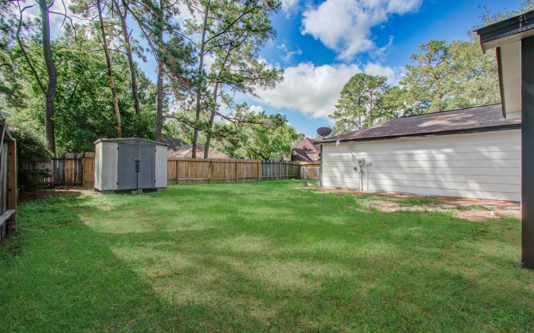 4735 Theall Road Houston, TX 77066 - Photo 35 of 36 a backyard of a house with lots of green space