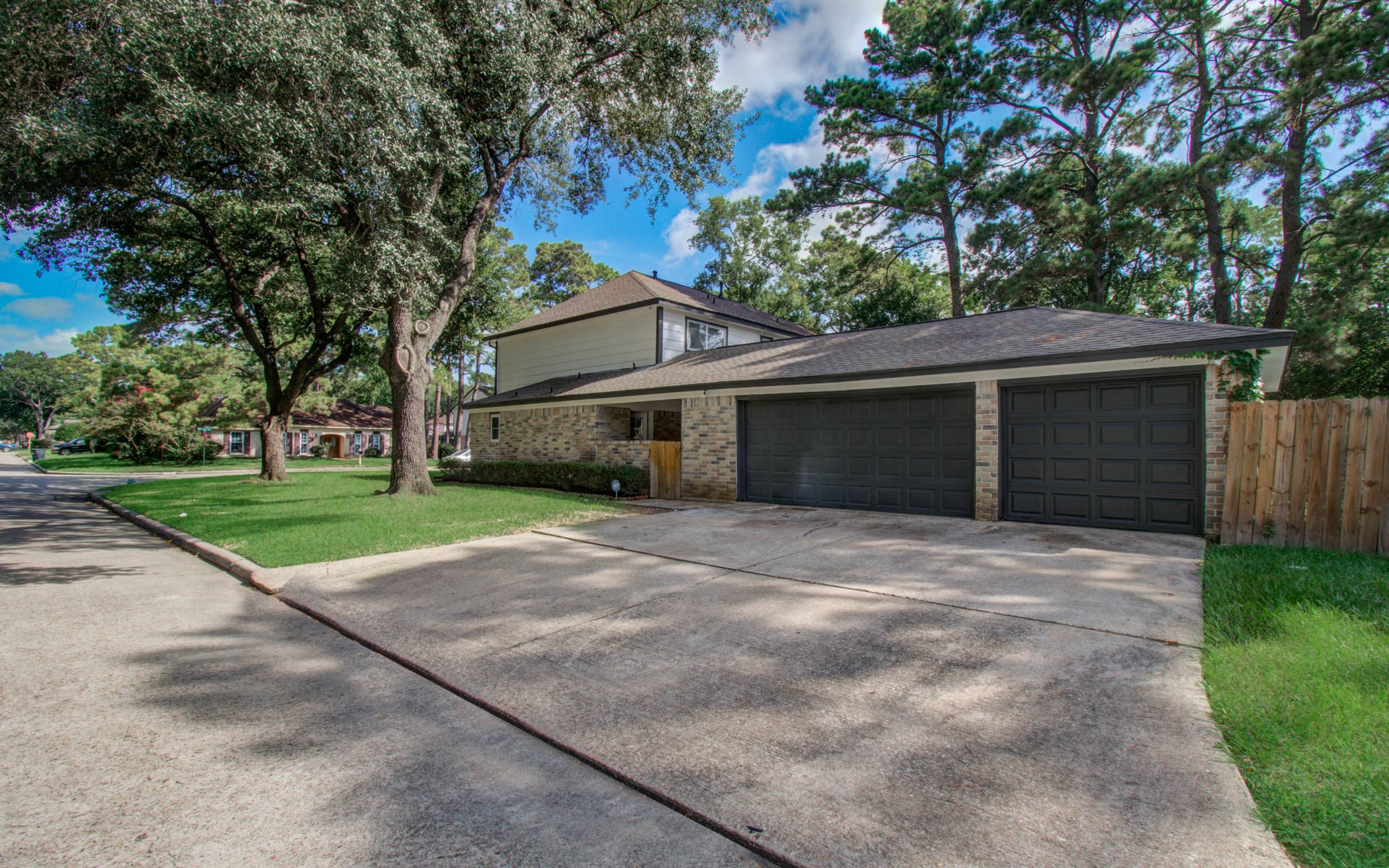 4735 Theall Road Houston, TX 77066 - Photo 4 of 36 a front view of a house with a yard and garage