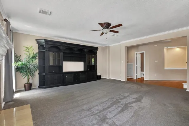 a kitchen with stainless steel appliances granite countertop a sink a stove and a window