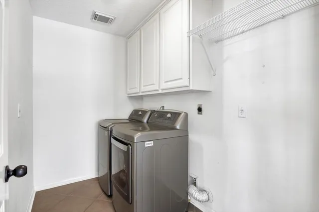 a view of an entryway with wooden floor and staircase