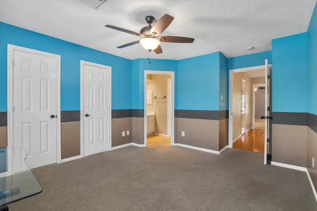 a bathroom with a double vanity sink and mirror