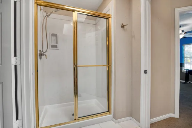 a en suite bathroom with a sink and mirror