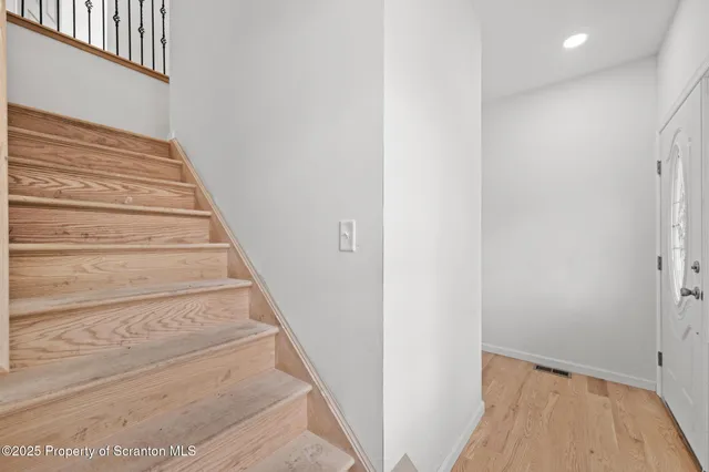 a bathroom with a bathtub and toilet