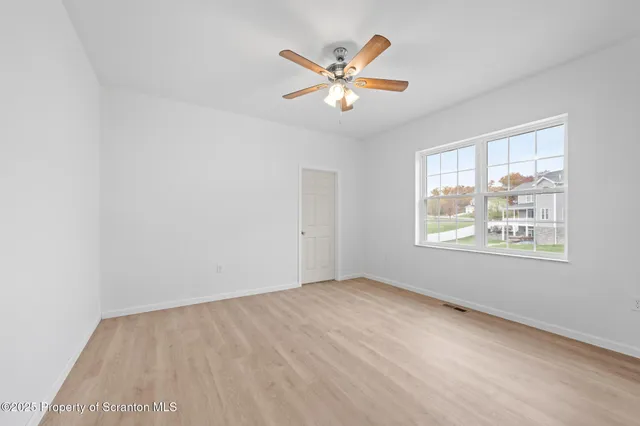 a view of a room that has a window in it