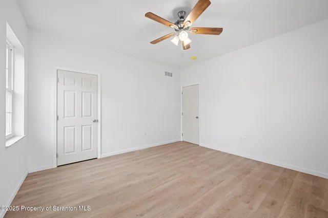 a bathroom with a granite countertop sink and toilet