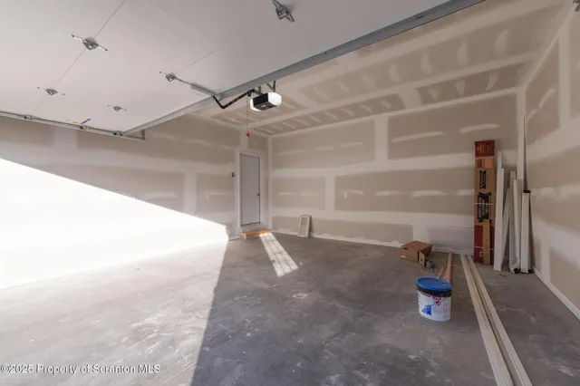 an aerial view of residential houses with outdoor space and street view