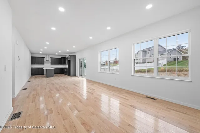 a view of kitchen with furniture and window