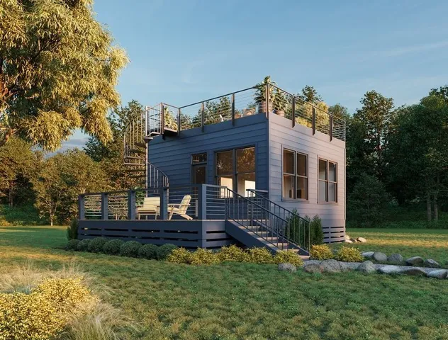 a view of a house with backyard and sitting area