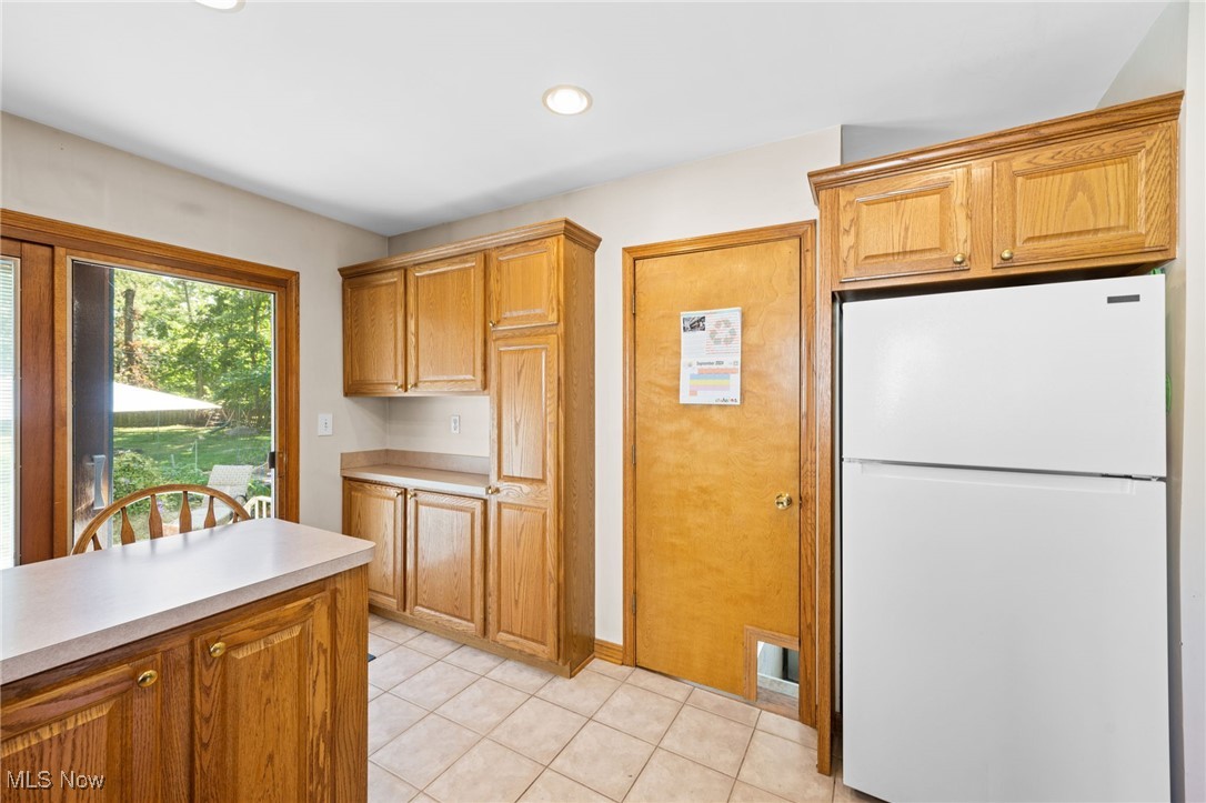 3918 Bluestone Road Cleveland Heights, OH 44121 - Photo 9 of 27 Kitchen with light tile floors and white fridge