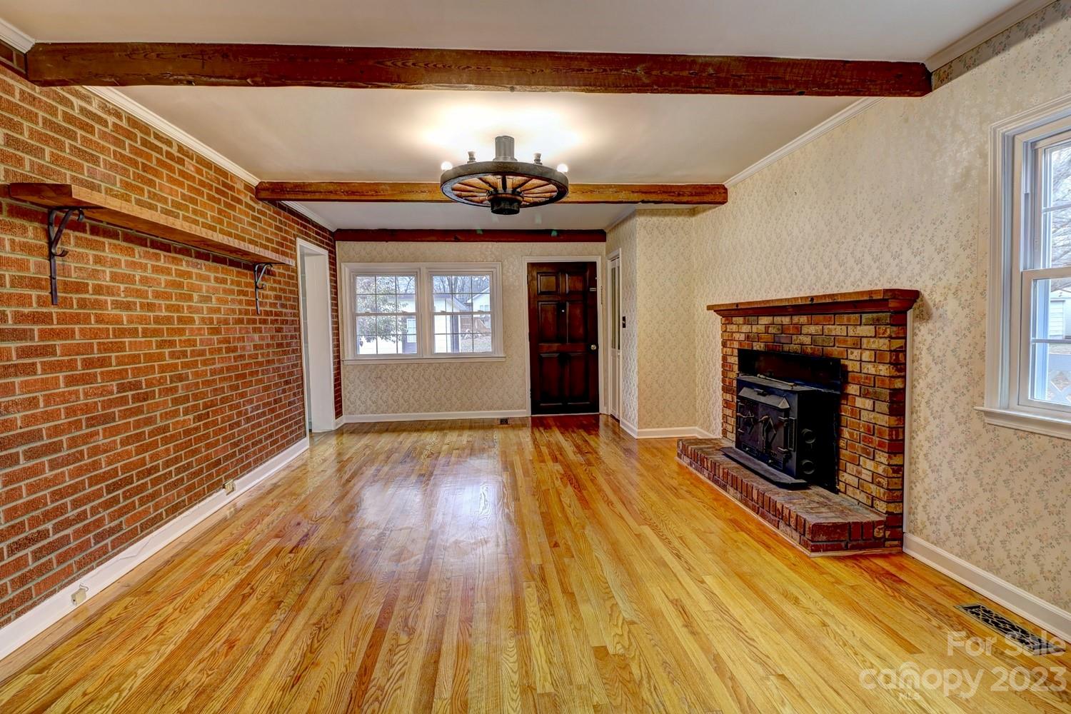 1408 Delview Road Cherryville, NC 28021 - Photo 12 of 23 a view of a livingroom with wooden floor and a fireplace