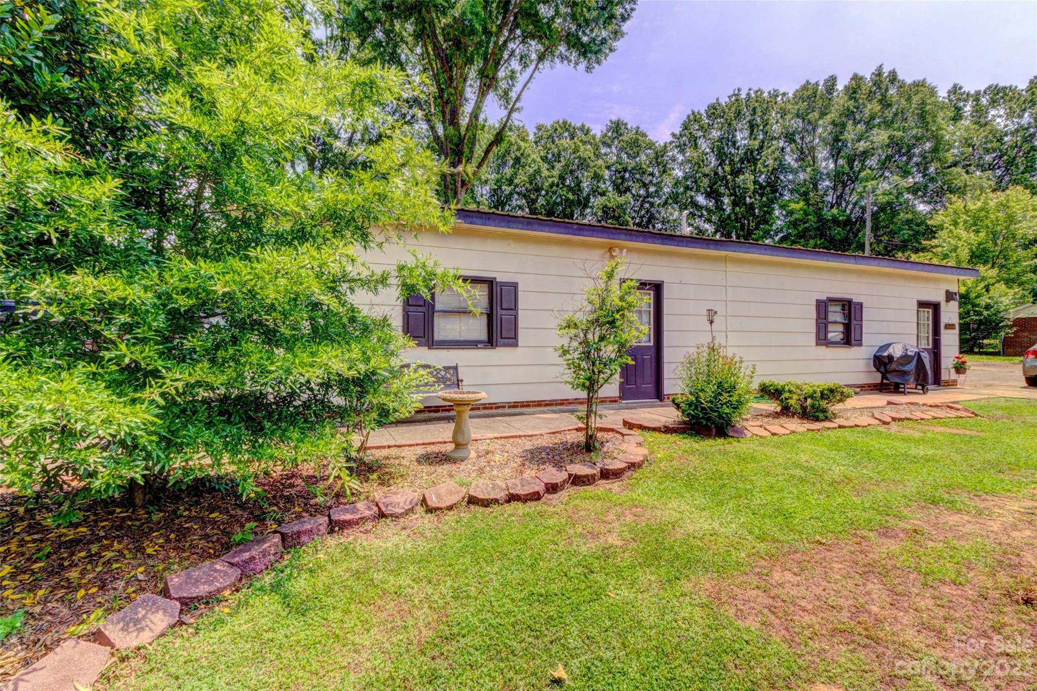 1408 Delview Road Cherryville, NC 28021 - Photo 19 of 23 a view of a house with backyard and a garden