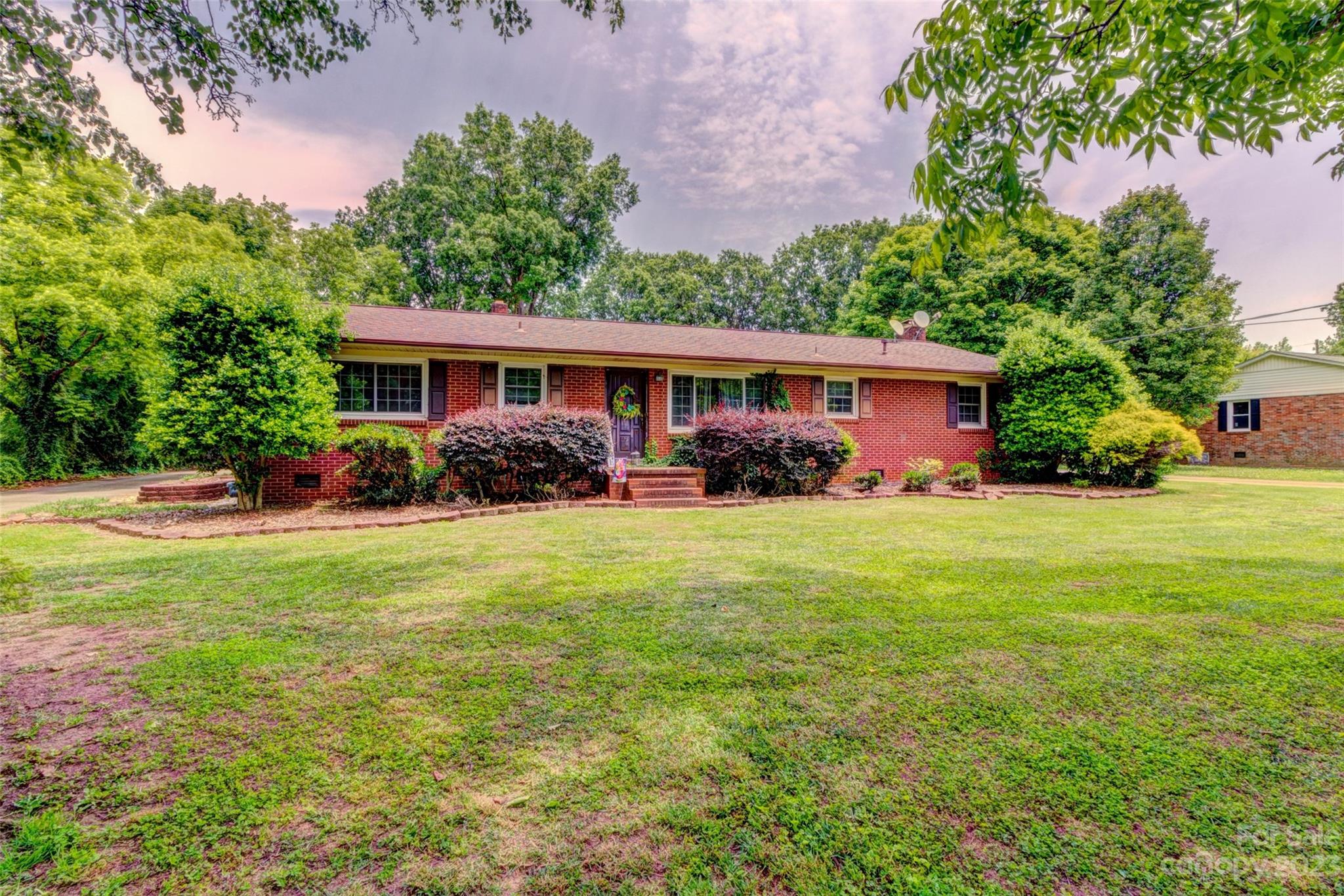 1408 Delview Road Cherryville, NC 28021 - Photo 2 of 23 a front view of house with yard and outdoor seating