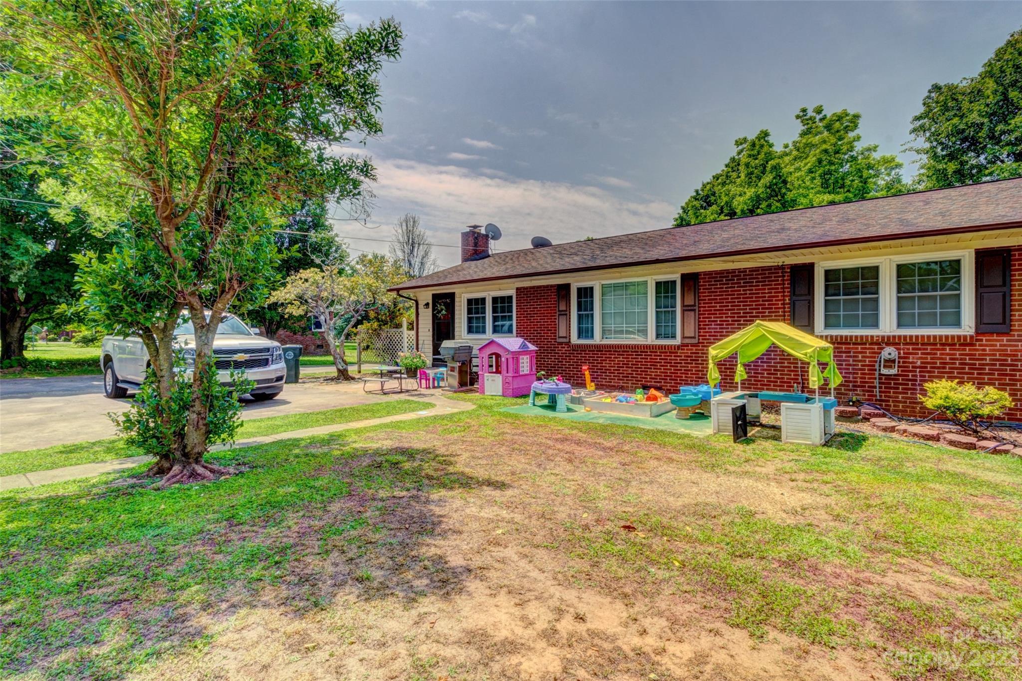 1408 Delview Road Cherryville, NC 28021 - Photo 22 of 23 a view of patio with a table and chairs under an umbrella