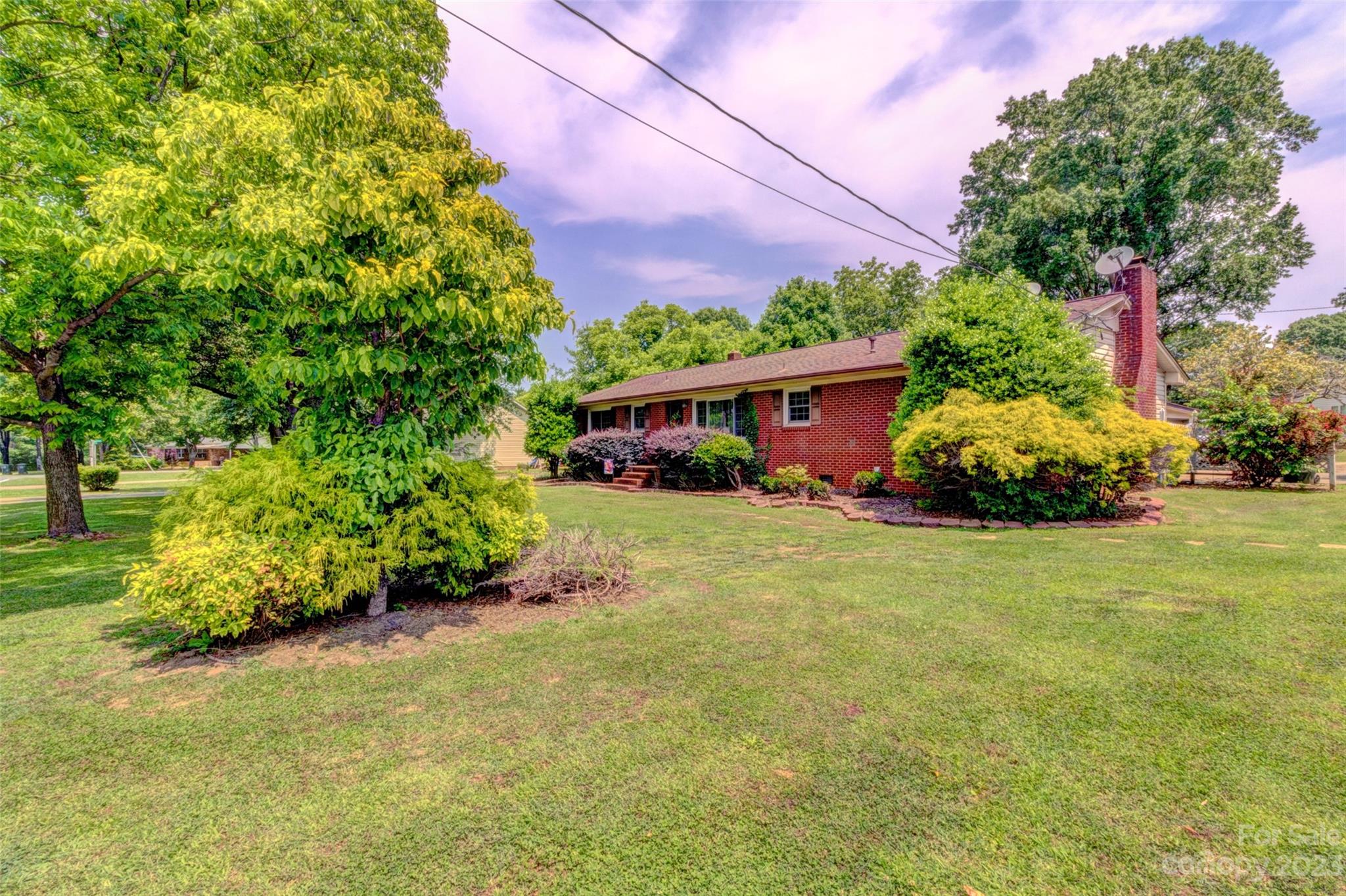 1408 Delview Road Cherryville, NC 28021 - Photo 3 of 23 a front view of a house with a yard and garage
