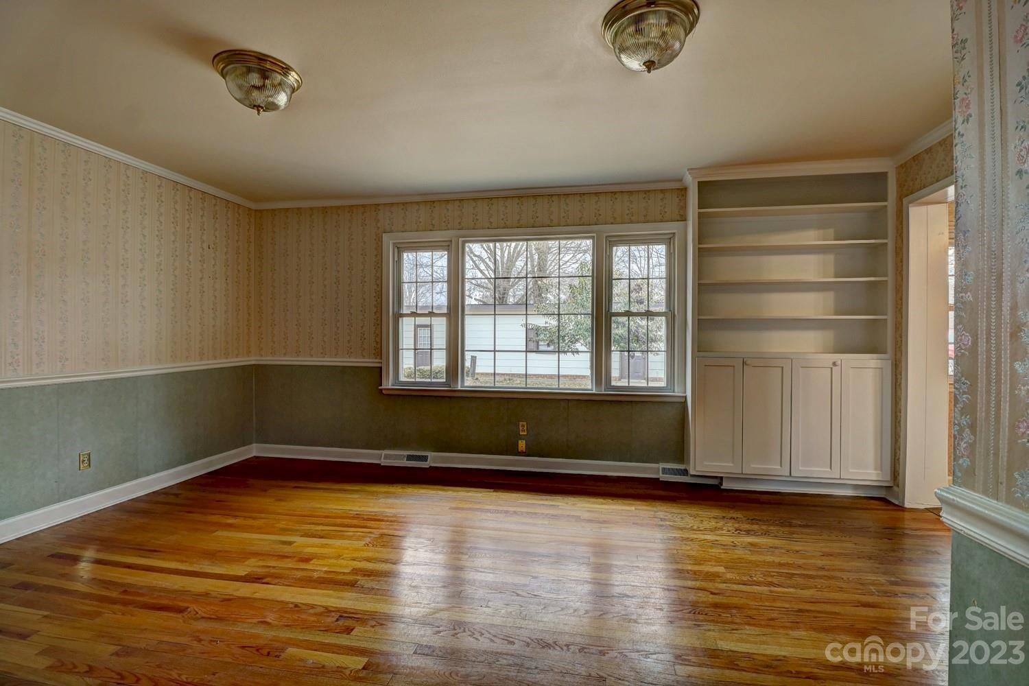 1408 Delview Road Cherryville, NC 28021 - Photo 10 of 23 an empty room with wooden floor and windows